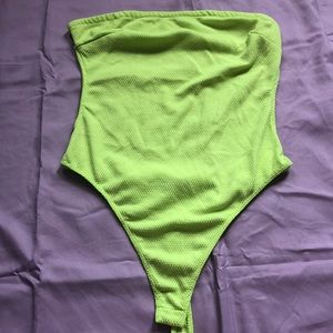 backless neon green body suit